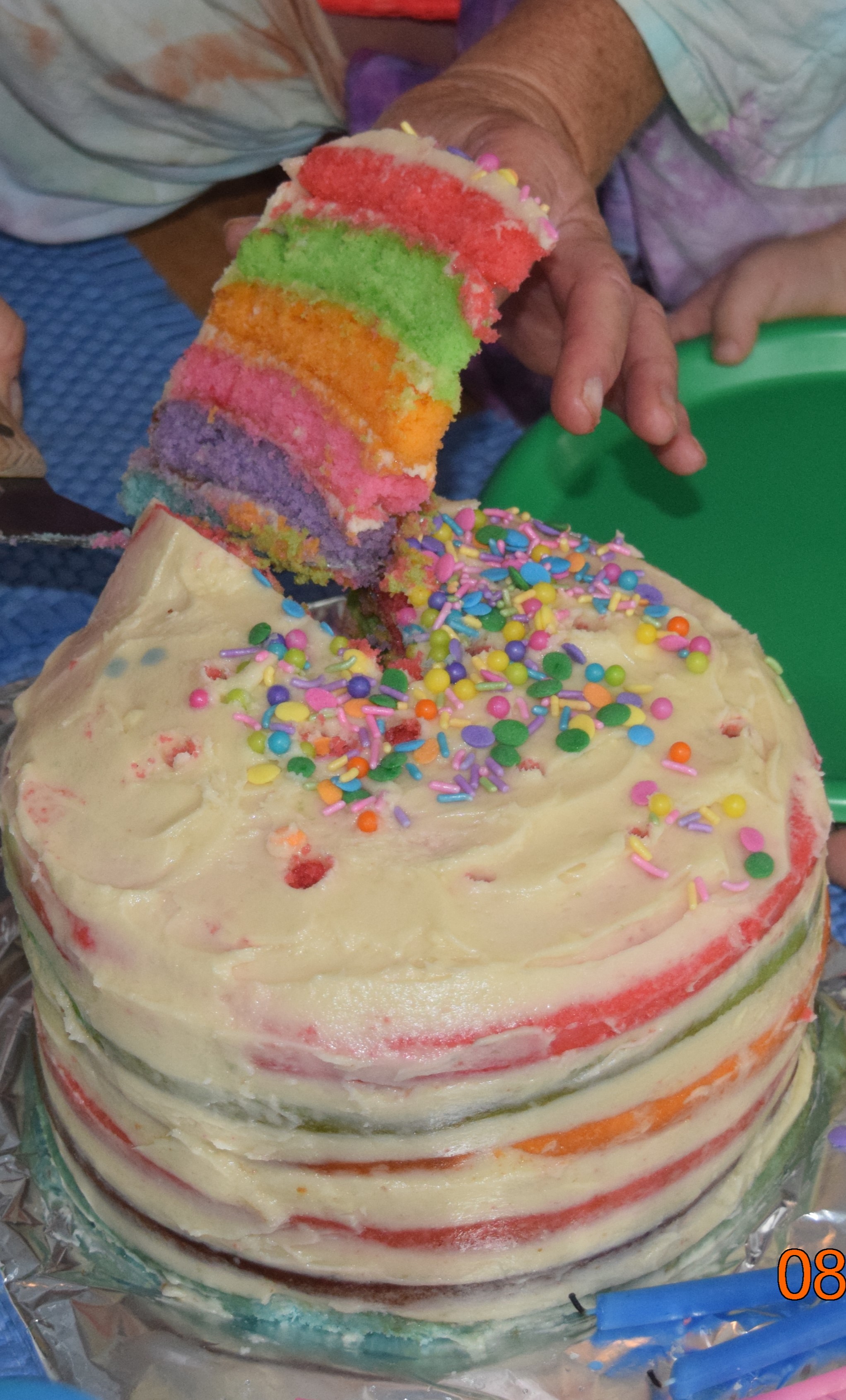 Grandmother-made, grandchildren-decorated Rainbow Cake.